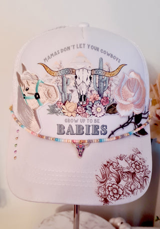 Mama's don't let your cowboy's grow up to be babies trucker hat